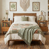 Bamboo rattan nightstand in walnut with raised edges, flip-up door, and open shelf for convenient storage in any room.