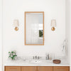 Bamboo small medicine cabinet with mirror door, showcasing a sleek design and varnished surface in a bathroom setting.