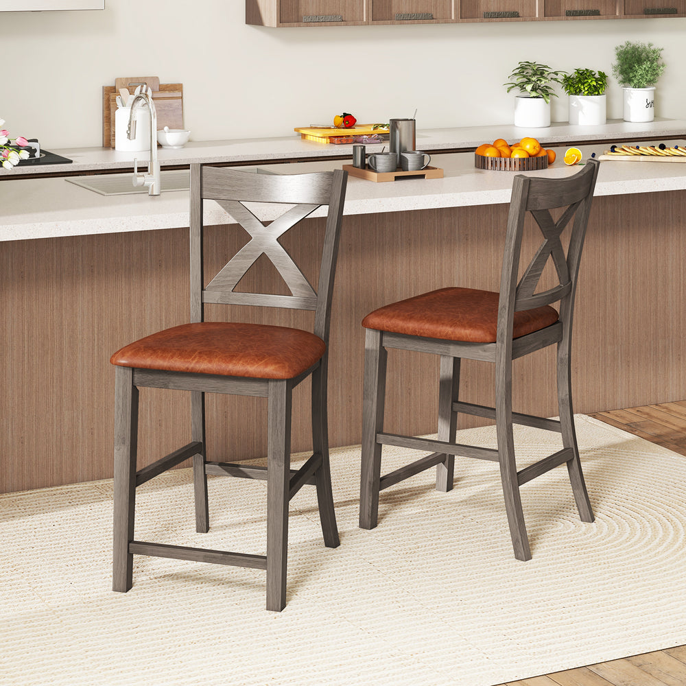 Set of 2 gray bar stools with cross back and faux leather upholstered seats for stylish kitchen seating.