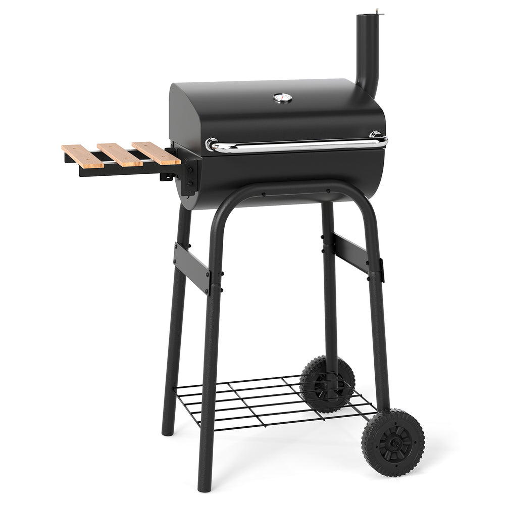 Barrel charcoal grill in black with foldable side table, built-in thermostat, and wheels for easy transport.