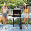 Barrel charcoal grill with foldable side table, featuring a built-in thermostat, perfect for backyard gatherings.