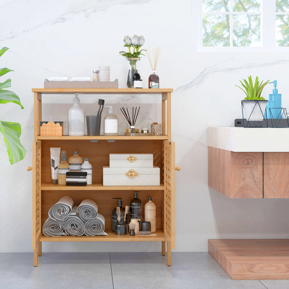 Bamboo bathroom floor storage cabinet with slatted doors, open shelf, and countertop for organizing various items.