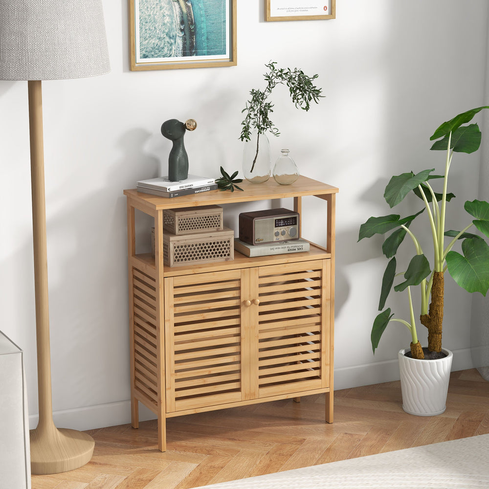 Bamboo bathroom floor storage cabinet showcasing slatted doors, elevated legs, and natural finish for stylish.