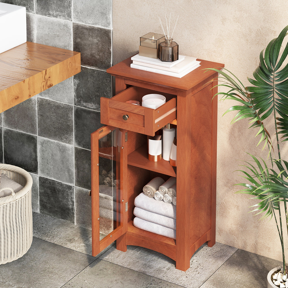 Freestanding brown bathroom storage cabinet with glass door, drawer, and adjustable shelf for organized toiletries and.