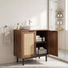 Freestanding bathroom vanity cabinet with rattan doors, U-shaped cut-out, and metal legs for stylish storage.