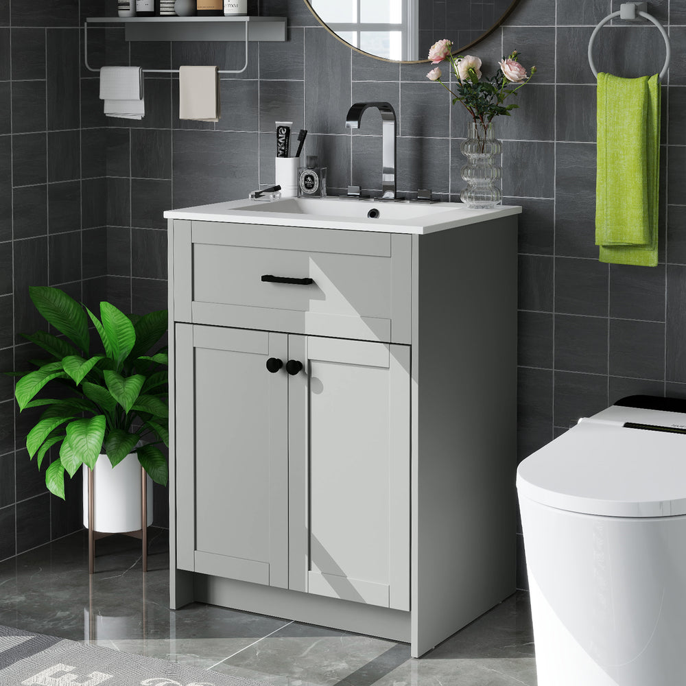 Gray bathroom vanity unit with ceramic basin, two doors, and sleek handles for elegant storage and organization.