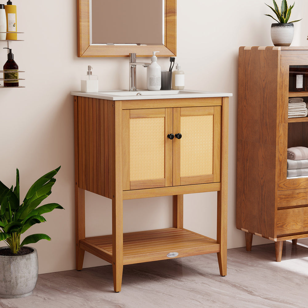 Bathroom vanity with ceramic sink, two rattan doors, and slatted shelf, crafted from acacia wood for compact spaces.