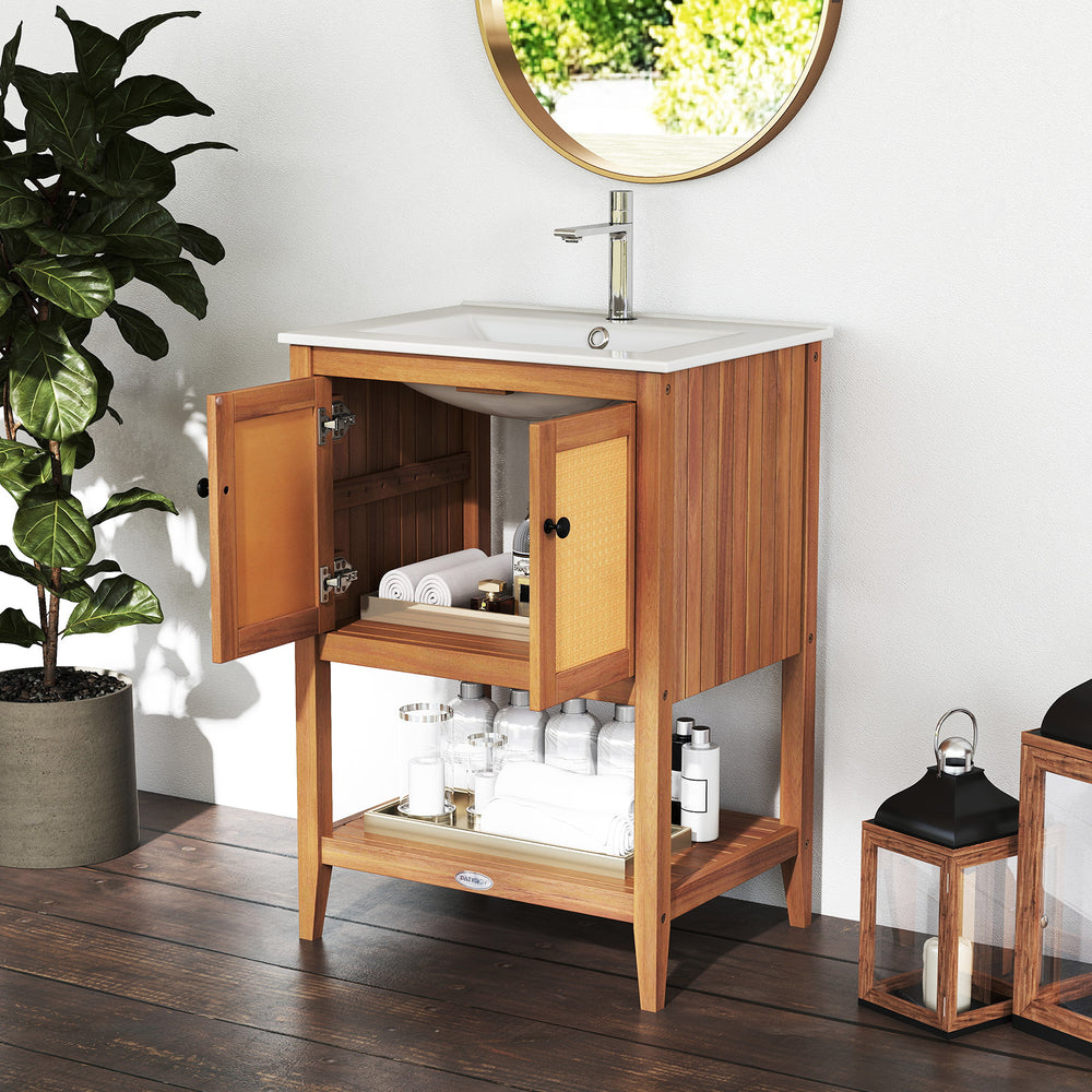 Bathroom vanity with ceramic sink, acacia wood, rattan doors, and slatted shelf for stylish storage in compact spaces.