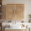Natural wood bathroom wall cabinet showcasing slatted doors and neat pull handles, ideal for stylish and ventilated.
