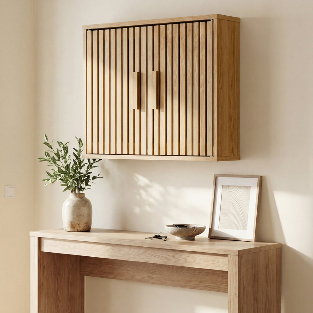 Bathroom wall cabinet with slatted doors and adjustable shelves, perfect for space-saving storage in any room.