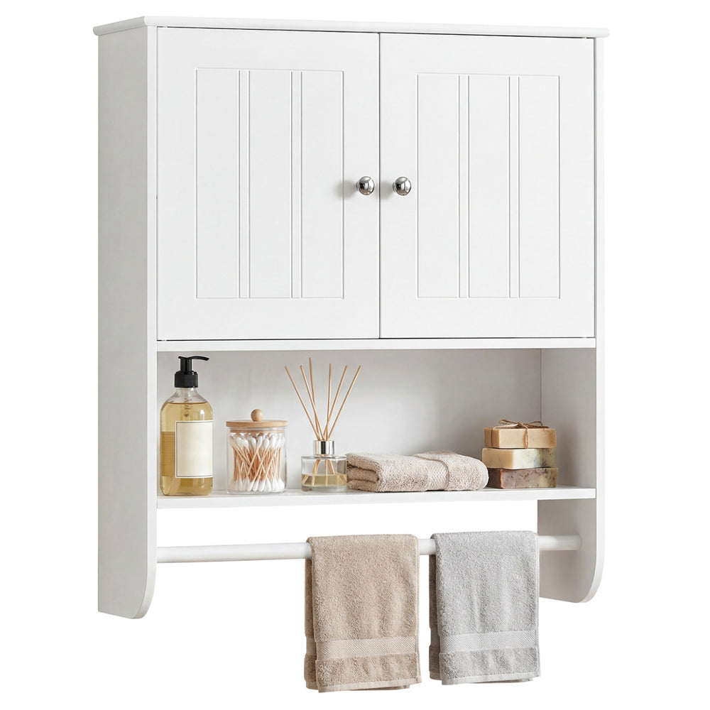 Close-up of the sleek metal knobs and magnetic catch on a white bathroom wall cabinet with adjustable shelf and towel.
