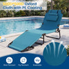 Beach chaise lounge chair in blue with adjustable backrest, removable pillows, and face hole for sunbathing by the pool.