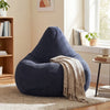 Blue bean bag chair with corduroy cover and soft sponge filling, perfect for relaxing in living rooms or bedrooms.