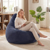 Bean bag chair in blue with corduroy cover, offering plush support and ergonomic shape for comfortable lounging.