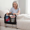 Height adjustable bed assist rail with padded handrail and mesh pocket for elderly adults, providing stability and.