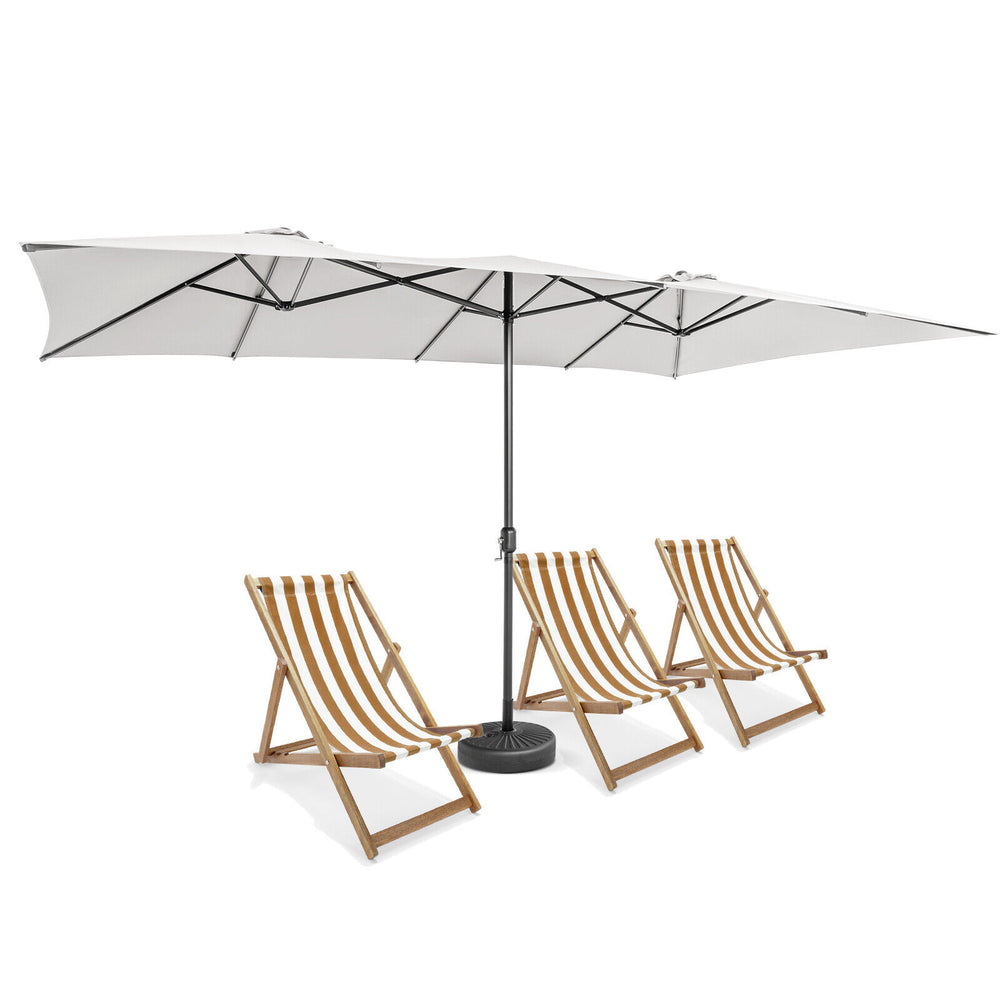Double-sized beige patio umbrella with crank handle and vented tops, providing ample coverage for outdoor seating.