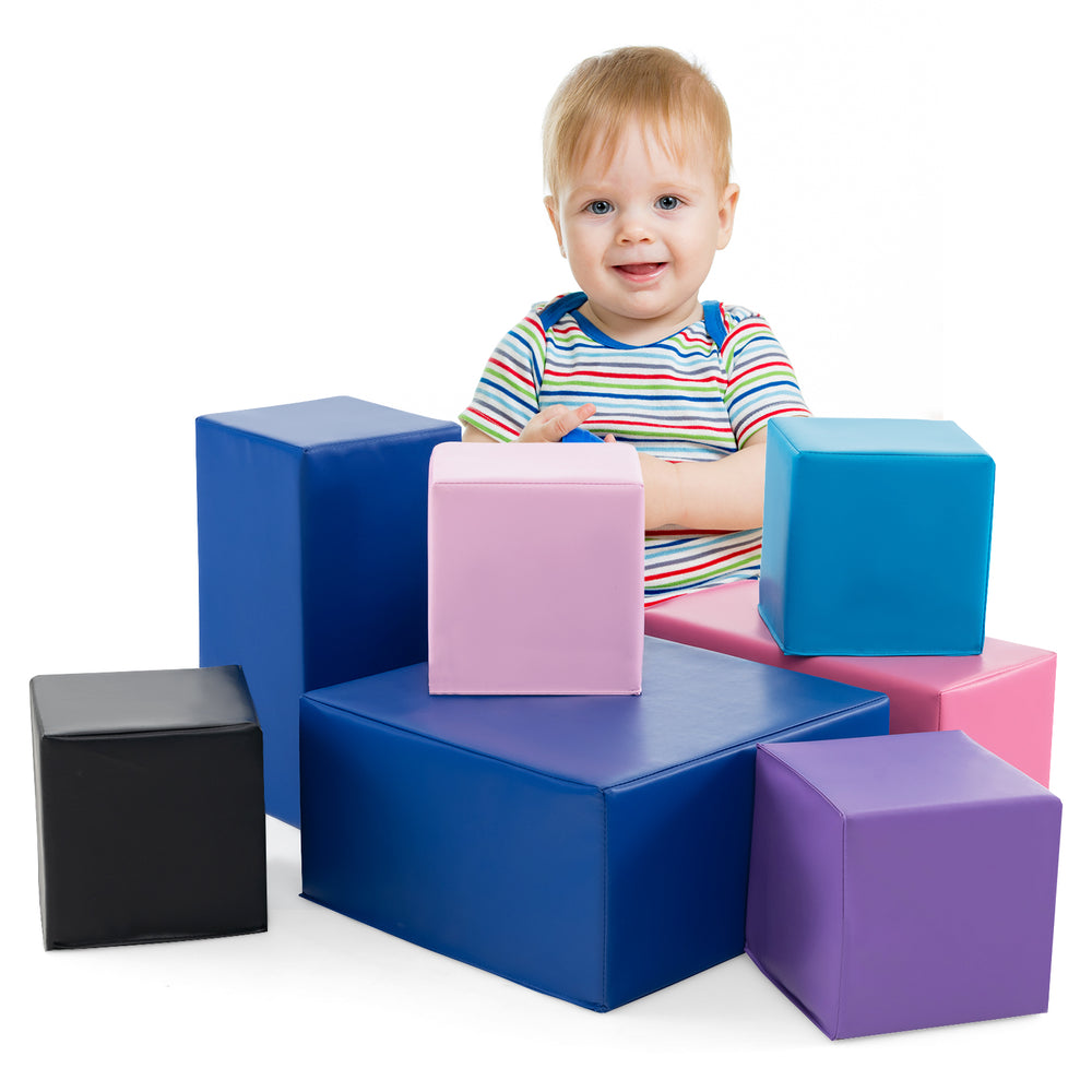 Brightly colored 7-piece foam building blocks arranged creatively, enhancing toddlers' motor skills and imaginative.