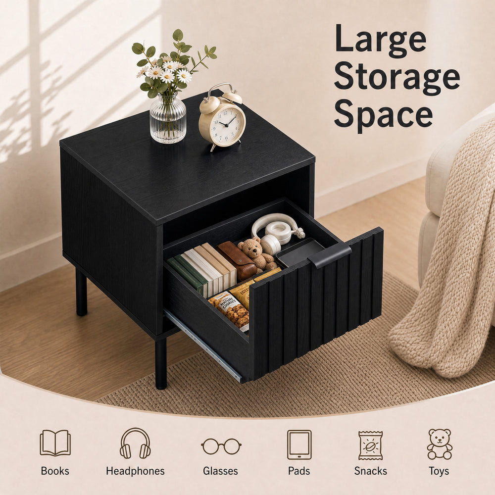 Black modern nightstand featuring a vertical-striped storage drawer and open shelf, perfect for compact bedside organization.