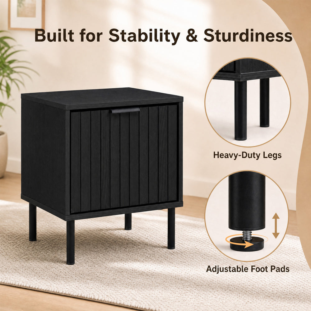 Black modern nightstand featuring a vertical-striped storage drawer and heavy-duty legs for stability in compact spaces.