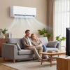 Couple relaxing on a sofa with the Blast Pro Series 12000 BTU mini split air conditioner providing efficient cooling.