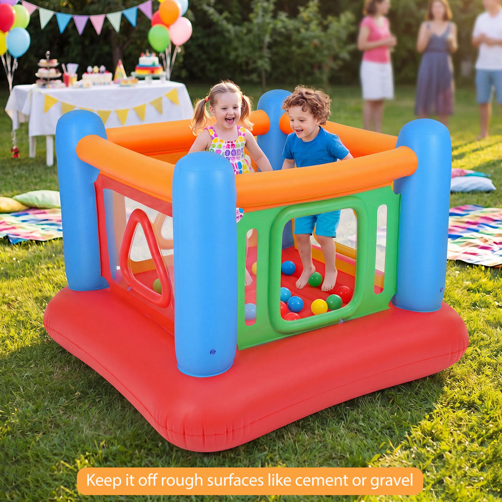 Kids enjoying the colorful inflatable jumping house with transparent side walls, designed for fun indoor and outdoor.