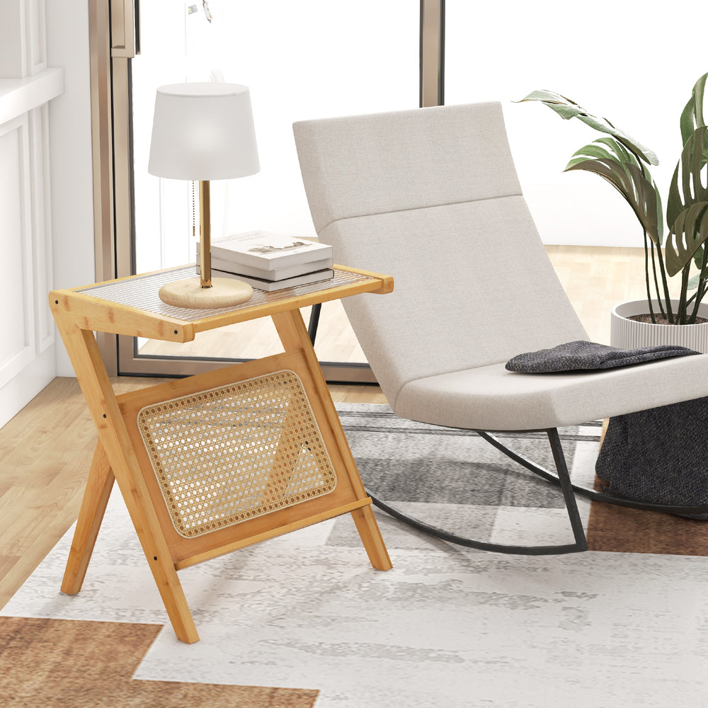 Boho end table with natural bamboo frame, tempered glass top, and magazine rack, perfect for stylish living spaces.