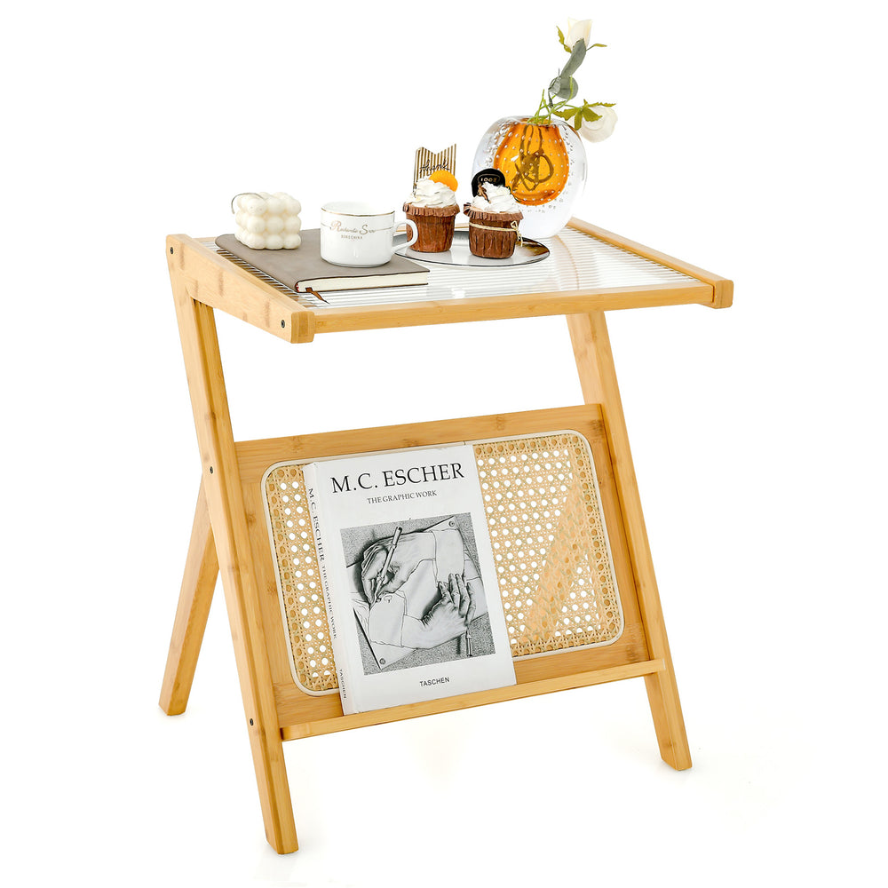 Boho end table with a natural bamboo frame, tempered glass top, and rattan magazine rack for stylish organization.