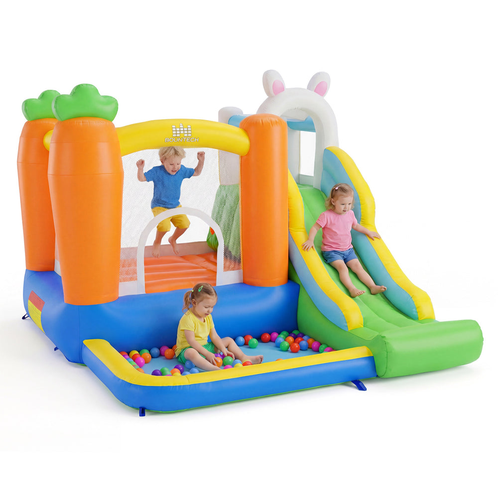 Bounce house for kids featuring a climbing wall, slide, and ball pit, perfect for backyard parties and gatherings.