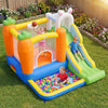 Kids enjoying the bright bounce house with a basketball rim, climbing wall, and colorful ball pit for outdoor fun.