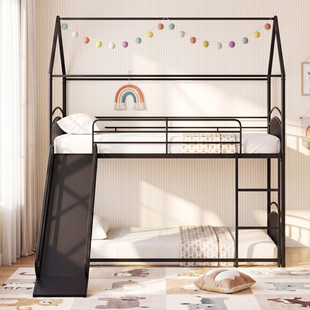 Twin-over-twin black metal bunk bed with slide, featuring sturdy slats and high guardrails for kids' safety and fun.
