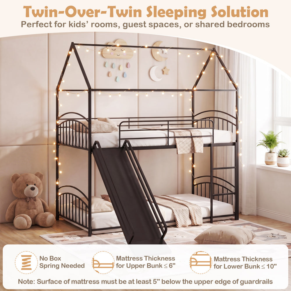 Twin-over-twin house bunk bed frame in black with integrated slide, perfect for kids' rooms and shared spaces.