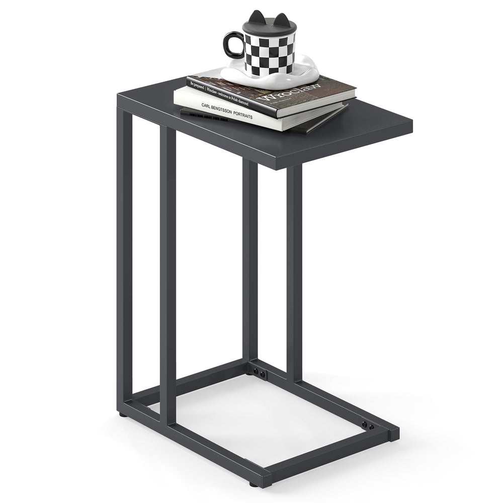C-shaped side table in dark gray with adjustable foot pads, perfect for snacks and drinks in living room or bedroom.