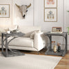 C-shaped grey end table with spacious tabletop and bottom shelf, perfect for lamps and decor in a modern living room.