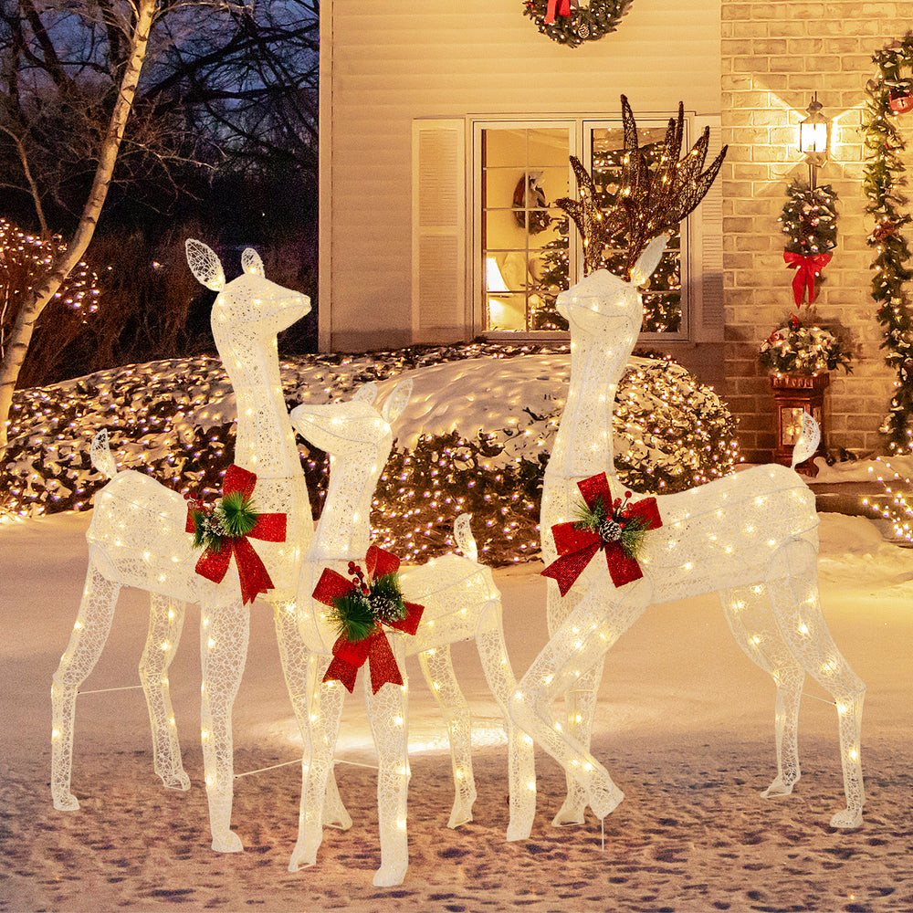 Three-piece pre-lit Christmas reindeer family with 230 warm white LED lights, perfect for festive outdoor decoration.