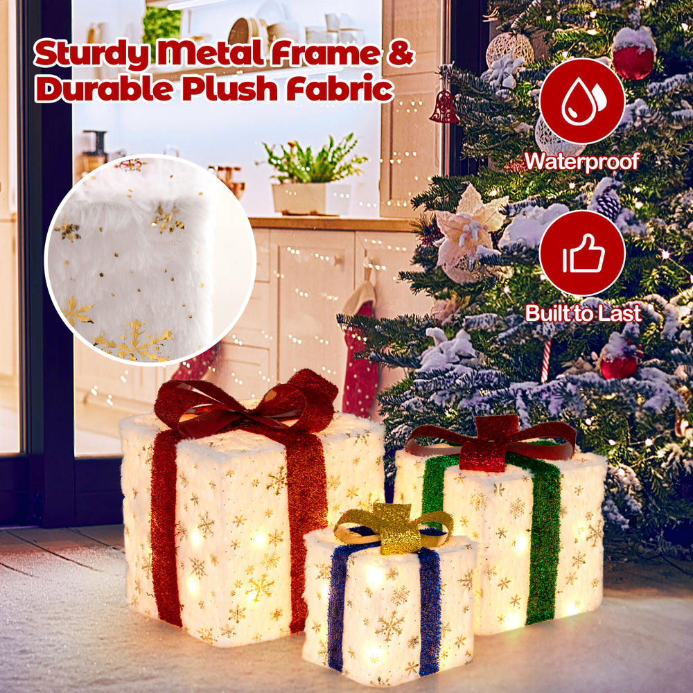 Set of 3 lighted Christmas gift boxes with colorful ribbons, snowflake patterns, and 48 warm lights for festive.