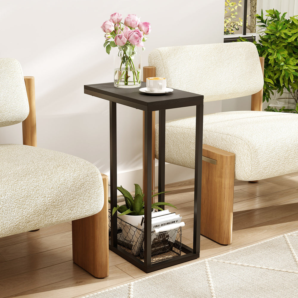 C-shaped end table in black with metal legs, perfect for holding drinks and snacks beside a couch or bed.