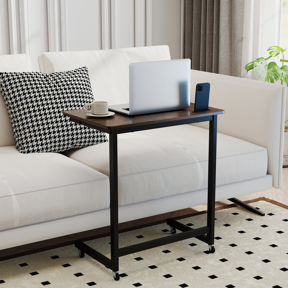 C-shaped end table with wheels in rustic brown, featuring a spacious top and built-in phone slot, ideal for couch use.
