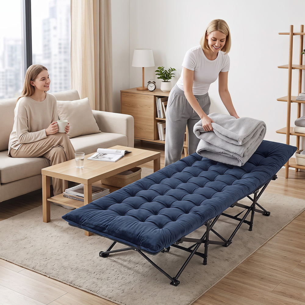 Camping cot with soft padded mat in navy, featuring a foldable design and carrying bag for easy transport and storage.