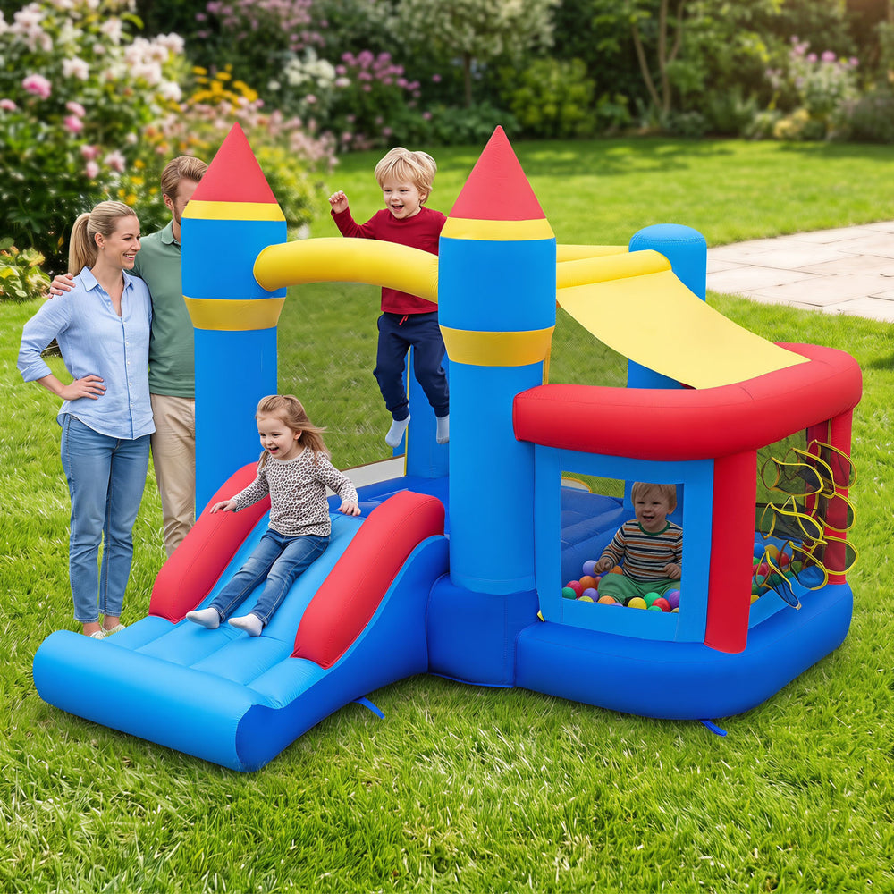 Colorful inflatable bounce house with slide, ball pit, and pitching game for outdoor birthday parties and active play.