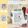Toddler playing with the Chef Pretend Kitchen Playset, featuring an ice dispenser and cooking accessories for.