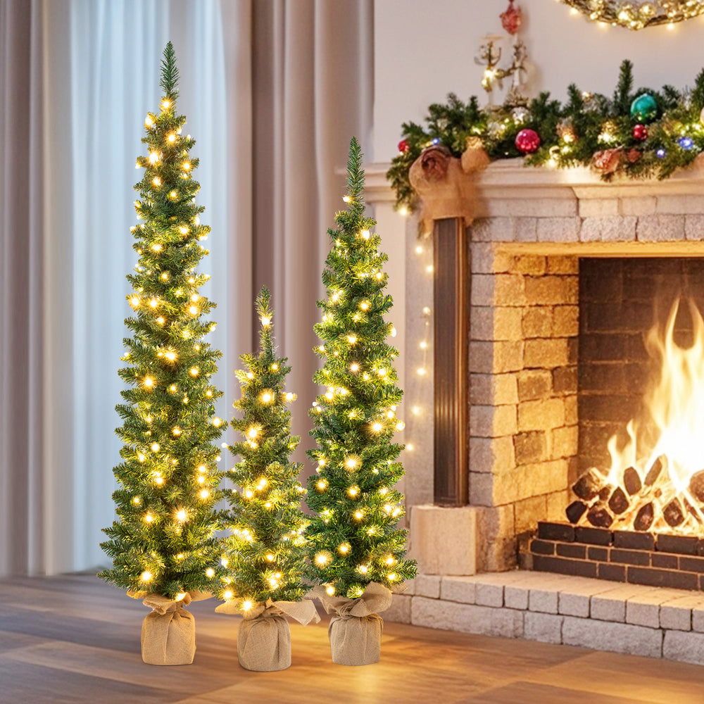 Slim pre-lit artificial Christmas tree with warm white LED lights, ideal for enhancing festive decor in compact spaces.