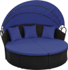 Round wicker patio daybed with retractable blue canopy and cushions, perfect for outdoor relaxation.