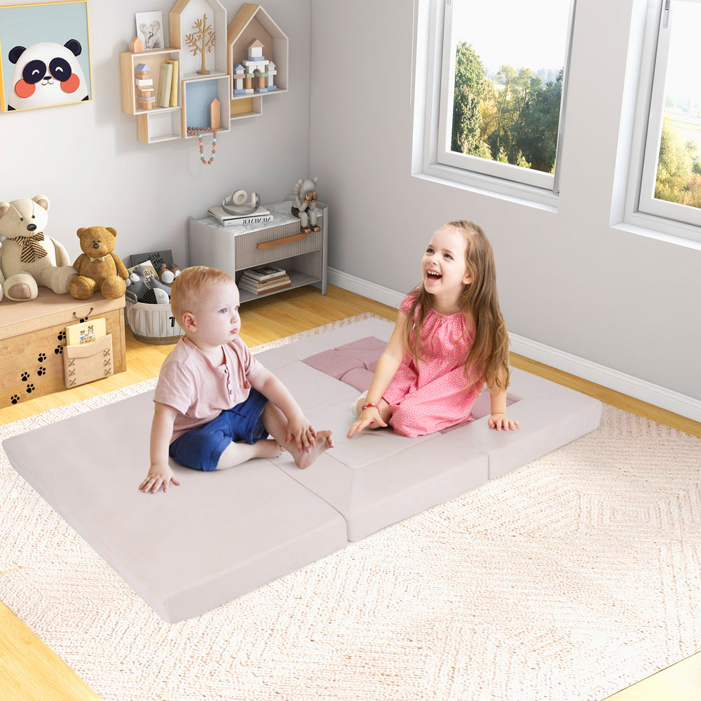 Soft pink foam playset featuring two children, ideal for climbing, crawling, and creative play in a cozy space.