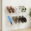 Wall-mounted metal wire shoe racks displaying various shoes, featuring a durable design for efficient space use.