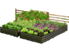 Large outdoor metal planter box with vegetables and herbs, made of rustproof powder-coated metal for durable gardening.