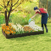 Large outdoor metal planter box with vibrant flowers, ideal for cultivating vegetables and herbs in your garden.