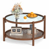 Round coffee table with tempered glass top and hand-woven rattan shelf, ideal for living room decor and storage.