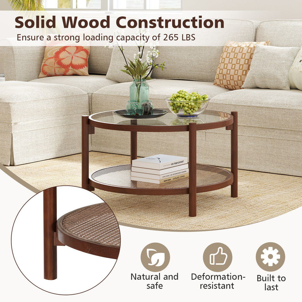 Round coffee table with tempered glass top and hand-woven rattan shelf, crafted from solid wood for living room.