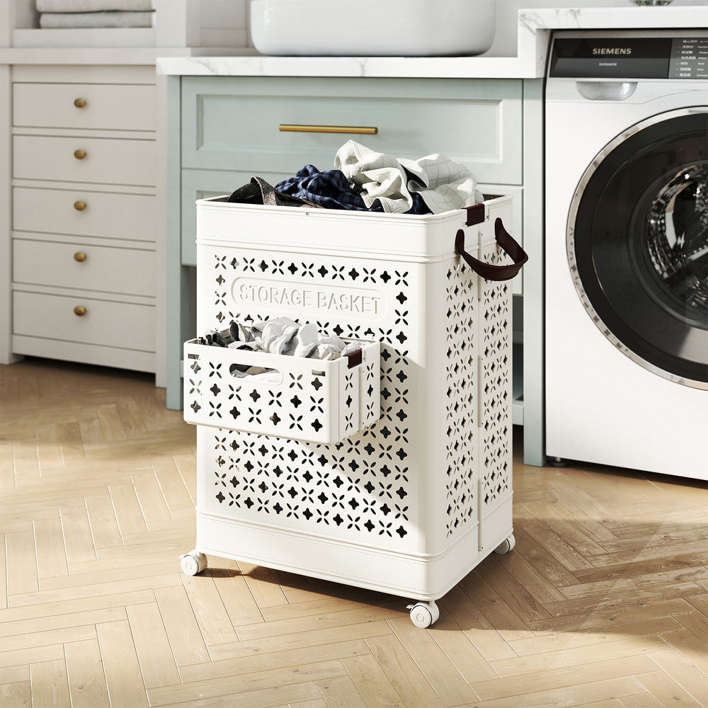 Collapsible white laundry basket with a large and small storage bin, featuring wheels for easy mobility and ventilation.