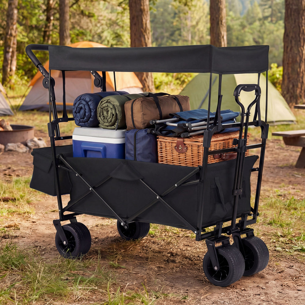 Collapsible wagon in black with removable canopy, spacious storage, and all-terrain wheels for outdoor adventures.